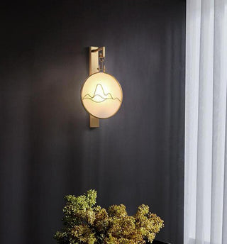 Gold marble wall lamp in Chinese and oriental style beside a curtained window