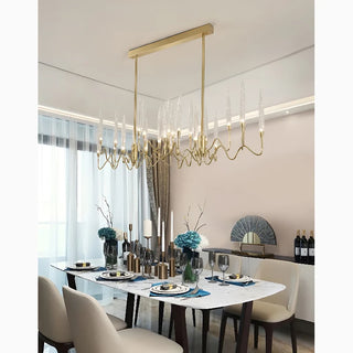 Altare gold icicle-style rectangular chandelier above a dining table