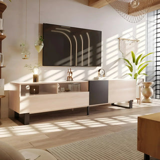 Light wood TV stand with a wall-mounted television in a bright living room