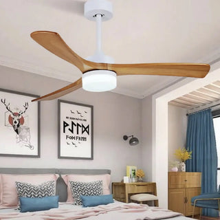 Wood-blade ceiling fan with integrated light in a bedroom, sized for the room