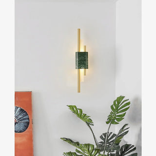 Girona postmodern LED marble wall lamp with green marble accent mounted on a living room wall