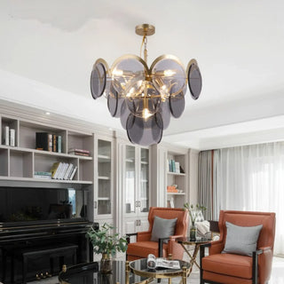 Amber glass chandelier hanging above a living room seating area