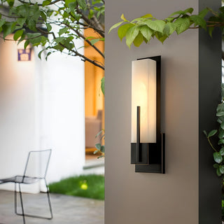 Black and gold outdoor wall lamp in copper and marble, IP65 waterproof, on a modern facade