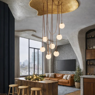 Nordic pendant light fixture with warm wood tones over a kitchen island in a Scandinavian-style living space