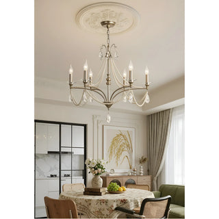 Crystal candle-style chandelier hanging in a classic dining room