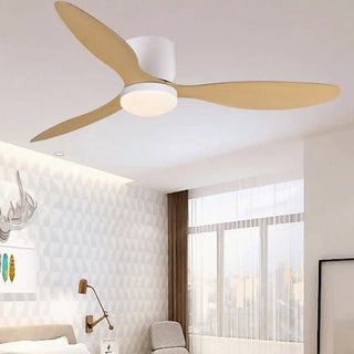 Modern wood-blade ceiling fan with integrated LED light mounted above a bedroom seating area by Mirodemi