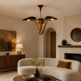 Black and brass mid-century dome chandelier hanging above a living room seating area