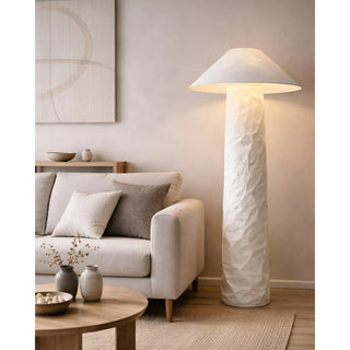 Wabi-sabi textured paper floor lamp beside a sofa in a Japandi-style living room