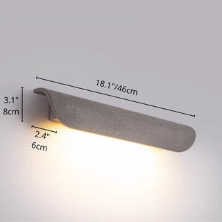 Gray concrete wall light with dimensions labeled: 46cm width, 8cm height, 6cm depth, glowing with warm LED light