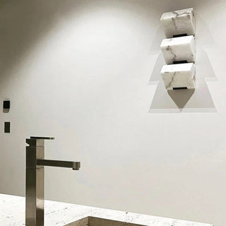Marble LED wall sconce with unique stone veining pattern
