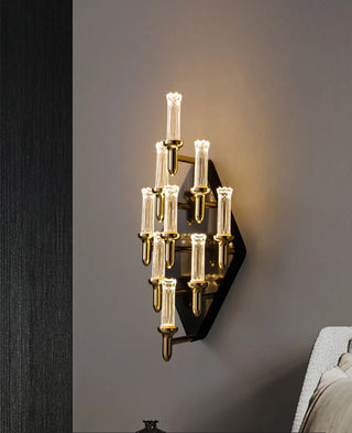 Gold curved-arm wall lamp above a console table