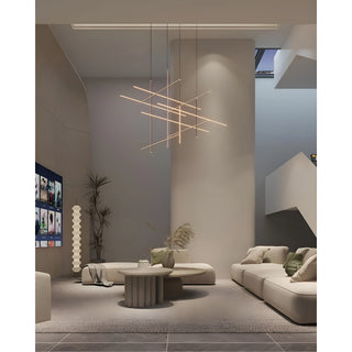 Modern double-height interior with Arden Linear Staircase Chandelier in minimalist gold finish, featuring geometric LED bars suspended from ceiling