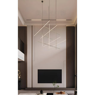 Double-height living space with modern geometric LED chandelier by Mirodemi, creating elegant architectural lighting with balanced symmetry