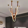 Sculptural Aurelia LED suspension lamp with long flowing leather curves, ideal for staircases or loft interiors