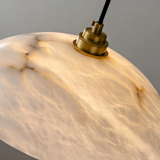 Close-up of glowing Lunara alabaster pendant - natural stone veins illuminated by warm LED light