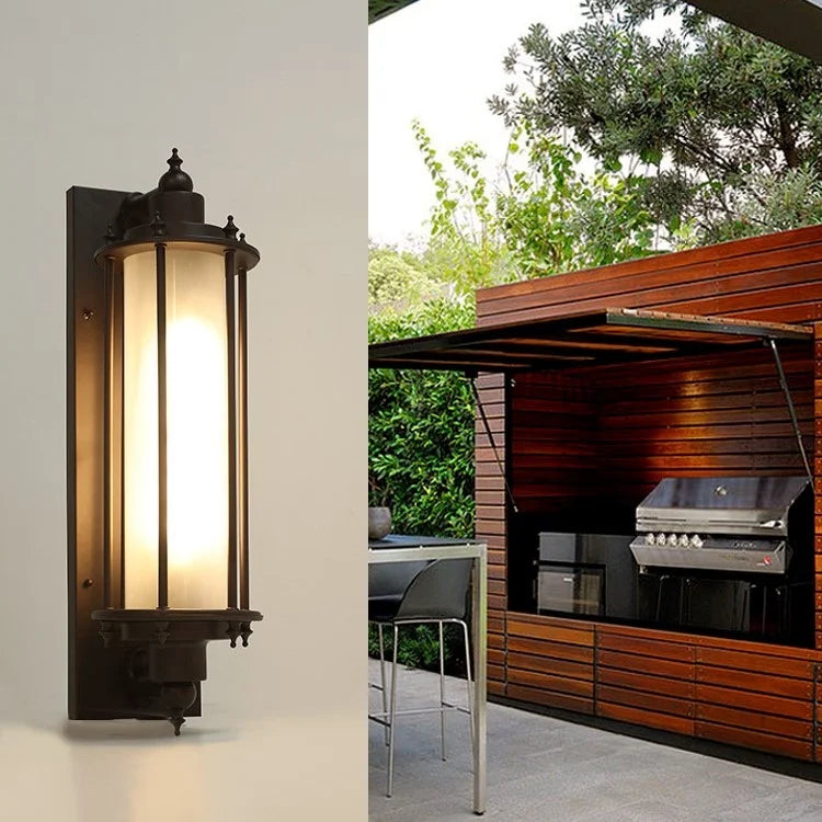 Aluminum outdoor wall sconce with glass lampshade