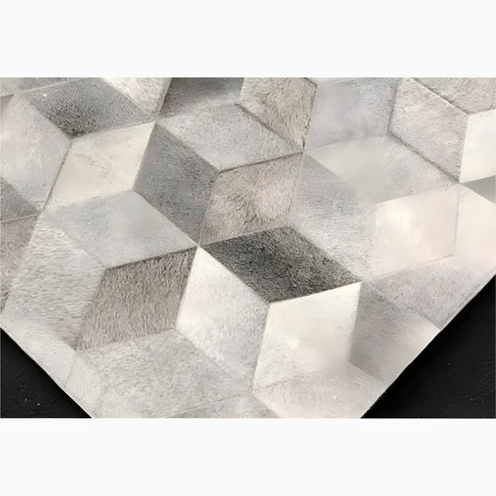 Contemporary Grey Cowhide Rug with Sleek Patterns | Minimalist cowhide carpet | Neutral grey palette | Durable natural fabric | Artistic geometric design