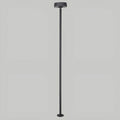 Tall minimalist garden light with round top and slim black base, shown on neutral background
