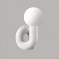 Modern white resin table lamp with frosted glass globe – sculptural minimalist bedside light by MIRODEMI