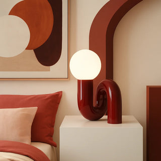 Wine red resin sculptural lamp in art-inspired bedroom décor – contemporary bedside lighting by MIRODEMI