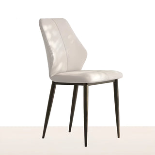 Modern white accent chair in side view, featuring a clean, upholstered seat and slim black legs