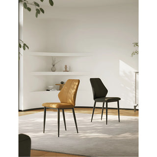 Caramel and black chairs arranged in a modern living space with natural lighting