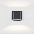 Aeris black aluminum wall light with symmetrical dual LED beams on white background