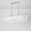Modern chandelier with clear glass shades on a white background