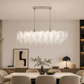 Altavilla Rectangular Murano Glass Chandelier in a modern dining room setting, above table with chairs and decor