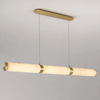 Alvara linear alabaster tube pendant with brushed brass caps and connectors on a neutral background