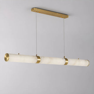 Side view of the Alvara alabaster tube pendant showing the illuminated stone and brass hardware