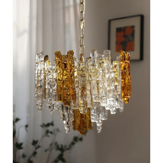 Artistic Murano chandelier with layered amber and clear handcrafted glass panels.