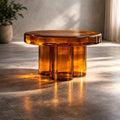 Amber translucent glass round accent table with architectural base