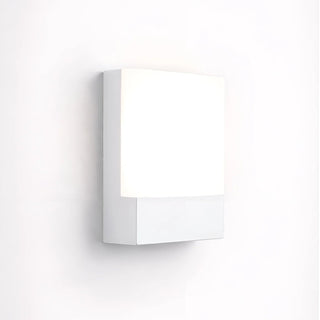 Angled view of the LED wall light in white finish, mounted on a white wall