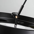Detail view of metal joint and brass accent on MIRODEMI black arc floor lamp - premium craftsmanship