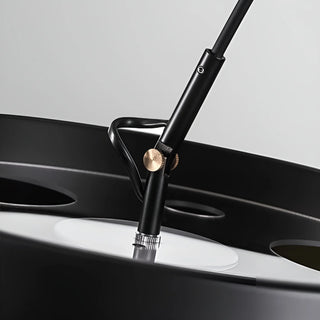 Detail view of metal joint and brass accent on MIRODEMI black arc floor lamp - premium craftsmanship