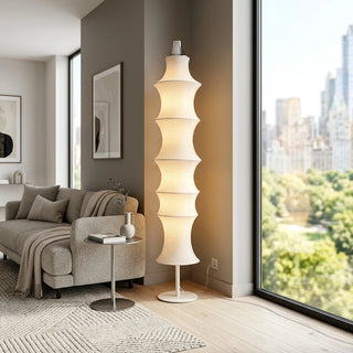 Aurelia white silk modern floor lamp illuminating a contemporary luxury living room corner