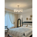 Aurem chrome glass chandelier installed in elegant classic bedroom interior