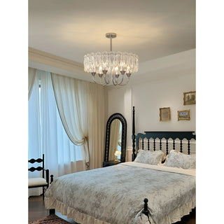 Aurem chrome glass chandelier installed in elegant classic bedroom interior