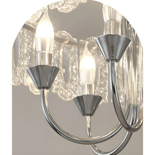 Close-up of illuminated bulbs and chrome arms on Aurem glass chandelier