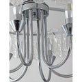Close-up detail of polished chrome frame and curved arms on Aurem glass chandelier