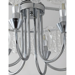 Close-up detail of polished chrome frame and curved arms on Aurem glass chandelier