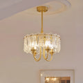 Illuminated Aurem dining room chandelier in brass finish with textured glass shade panels