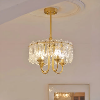 Illuminated Aurem dining room chandelier in brass finish with textured glass shade panels
