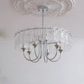 Modern Aurem glass chandelier in chrome finish with decorative textured glass elements