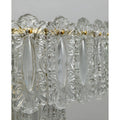 Decorative embossed glass panel detail on Aurem luxury chandelier