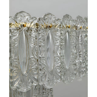 Decorative embossed glass panel detail on Aurem luxury chandelier