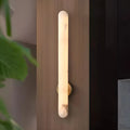Aurora alabaster vertical wall sconce creating soft ambient lighting in modern interior
