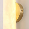 Detail of brushed brass backplate on Aurora alabaster wall light