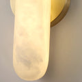 Glowing alabaster diffuser on Aurora modern wall sconce